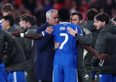 José Mourinho talks to Vinícius Júnior on the pitch