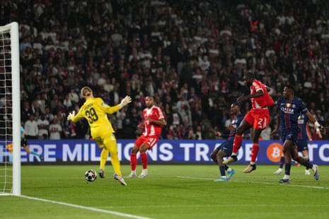 Bayern's Dayot Upamecano (second right) heads home to narrow the deficit.