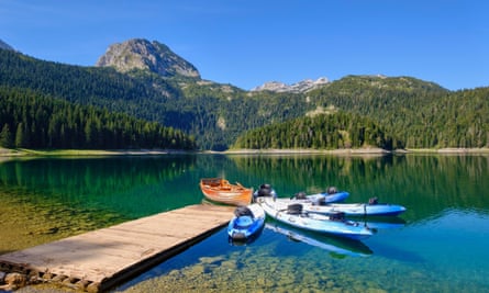 A lake and some moored boats in Durmitor national park, Montenegro.