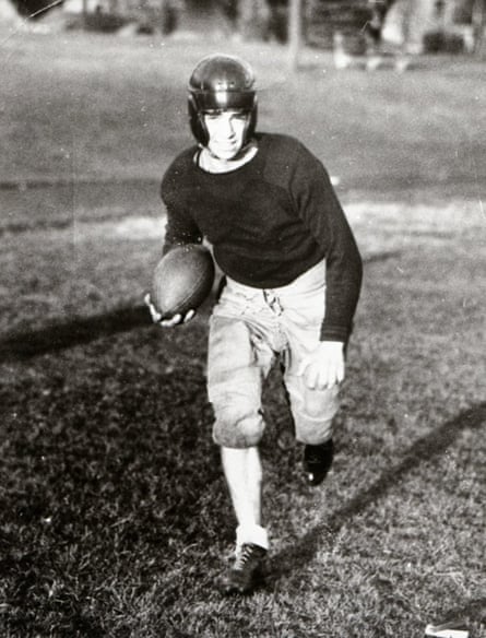 Man in black-and-white photo playing football