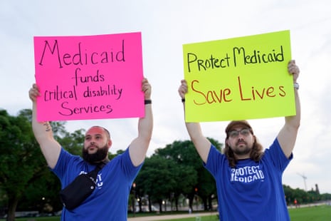 people hold signs that read 'Medicaid funds critical disability services' and 'protect Medicaid save lives'