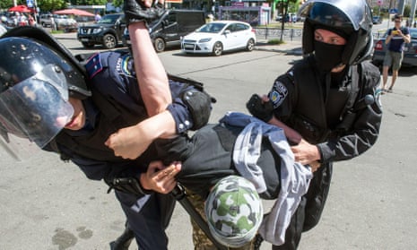 Riot police arrest a right-wing activist during a protest against the first ‘march of equality’ parade in Kiev.
