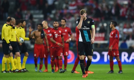 Per Mertesacker leaves the field dejected after Arsenal’s 5-1 defeat by Bayern Munich at the Allianz Arena in November 2015.