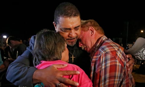 People embrace during a prayer vigil for victims of the First Baptist church massacre in Sutherland Springs, Texas.