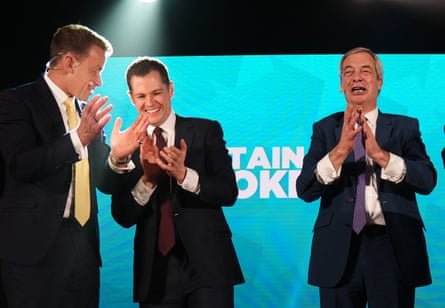 Jenrick on stage with Farage applauding at his unveiling as a Reform UK member