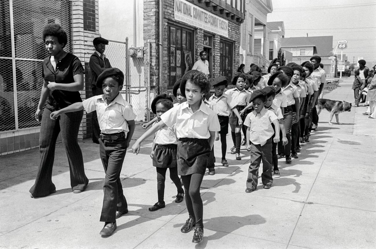 The sons and daughters of the Panthers parade past the Black Panther office on Shattuck Avenue, Berkeley, 1971.