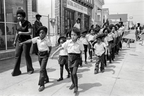 Panthers’ sons and daughters march in front of the Black Panther office on Shattuck Avenue, Berkeley, 1971.