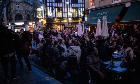 ‘There was sunshine and a sense of joyfulness in the streets. People were laughing out loud and drinking together and cheersing.’ People socialising in Soho on 16 April