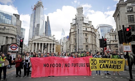 Extinction Rebellion climate change protesters block a road in the City of London.