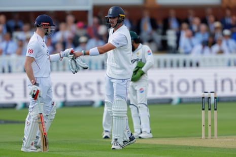England batters Josh Tongue (right) and Gus Atkinson bump fists.