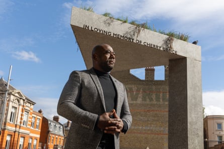 Lee Lawrence beside his mother’s memorial in Windrush Square, Brixton, south London
