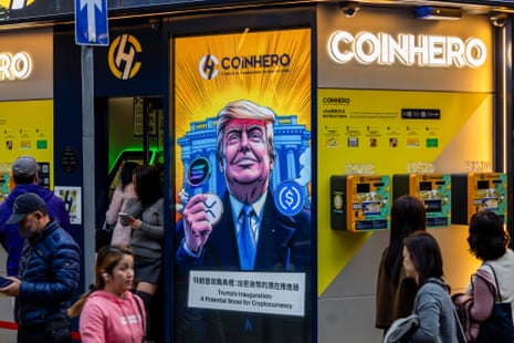 A cartoon image of Donald Trump holding a cryptocurrency token on a sign as people walk by