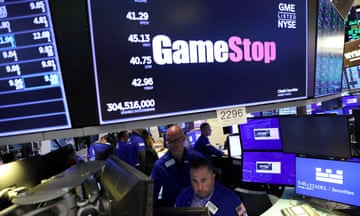FILE PHOTO: Traders work under signage for GameStop Corp. (NYSE: GME) on the trading floor at the New York Stock Exchange (NYSE) in Manhattan, New York City, U.S., August 8, 2022. REUTERS/Andrew Kelly/File Photo