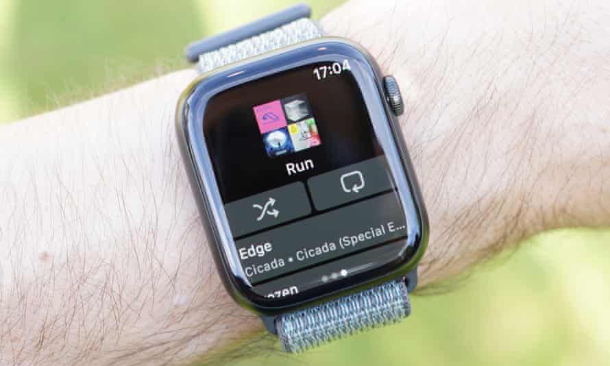 The Spotify app showing a running playlist on an Apple Watch.