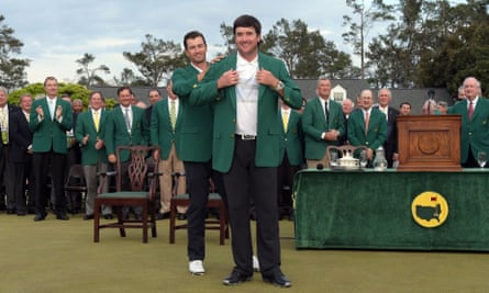 Adam Scott presents Bubba Watson with the Green Jacket – his second – in 2014.