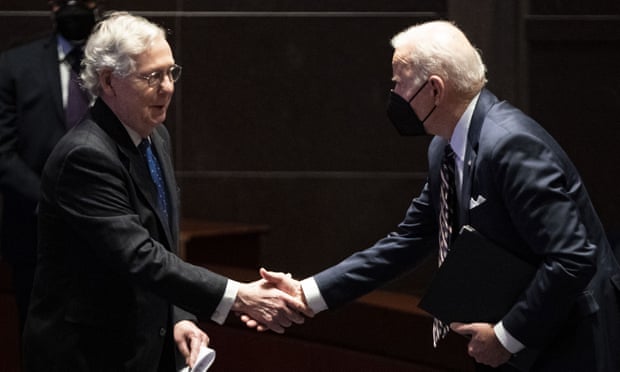 Joe Biden shakes hands with Mitch McConnell during the National Prayer Breakfast at the US Capitol.