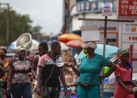 A woman sells hand sanitiser at the Makola market, Accra.