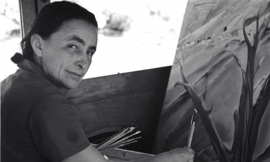 Georgia O’Keeffe painting in her car at Ghost Ranch, New Mexico.