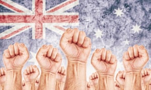 lia Labor movement, workers union strike concept with male fists raised in the air fighting for their rights<br>EDYPWR Australia Labor movement, workers union strike concept with male fists raised in the air fighting for their rights