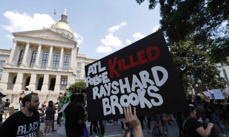 Protesters march near the Georgia Capitol after Atlanta police shot and killed Rayshard Brooks. 