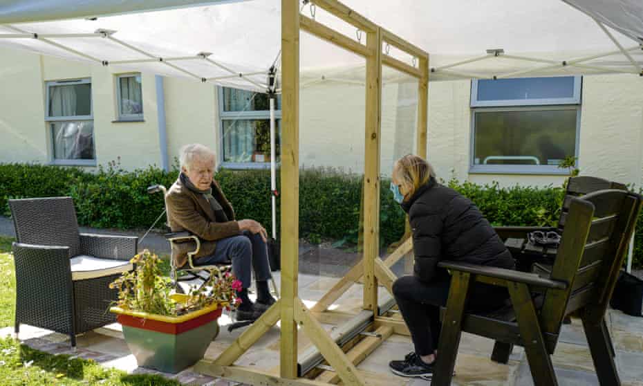  Karen Hastings visits her stepfather Gordon under an open-air shelter at the Langholme Care Home.