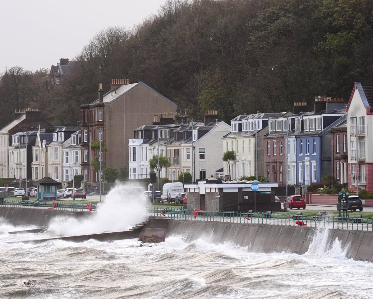Large waves crash against a seafront