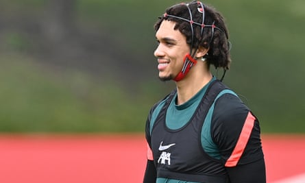 Liverpool’s Trent Alexander-Arnold wears analytical data headgear during a training session.