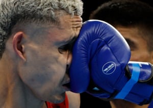 Australia’s Charlie Senior on the receiving end of a punch during his victory over Nauru’s Christon Amram in their featherweight round of 32 bout