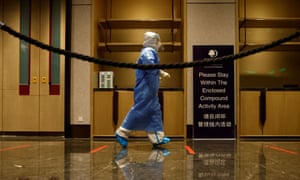 Covid live news: France to ease some restrictions; tsunami-hit Tonga enters lockdown | World news 1 A medial worker walks to a testing station inside the “closed loop” at the Beijing 2022 Winter Olympics. They wear blue PPE.