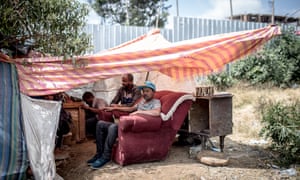 Bahru Nigusa in his makeshift tent after the second demolition.