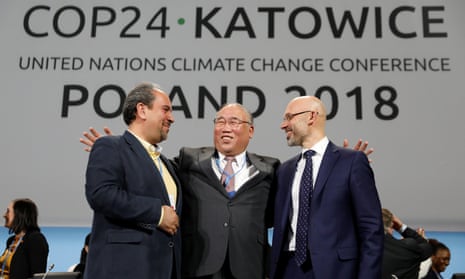 Delegates smile after adopting the final agreement at the COP24 UN climate change conference 2018 in Katowice, Poland.