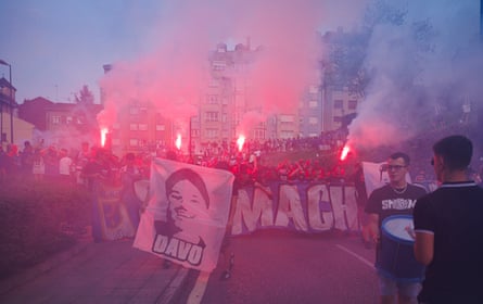 Flares are lit arsenic supporters descend connected nan ground.