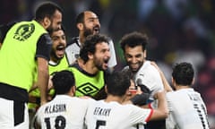 Egypt’s players mob their goalkeeper, Mohamed Abou Gabal, after his saves sent them to the Africa Cup of Nations final.