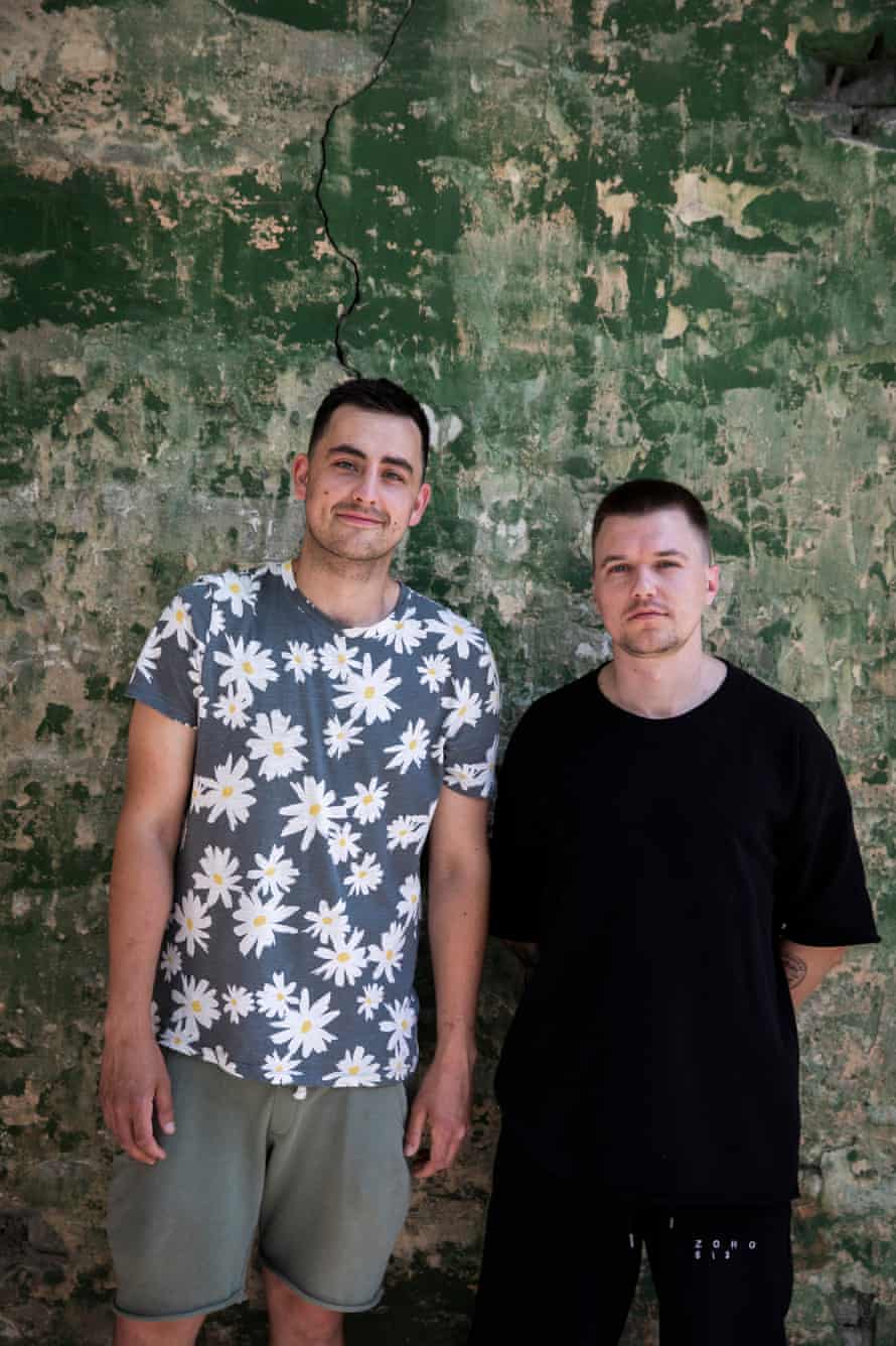 Yefym Konstantinovskyi (left), a volunteer at the shelter Good on Love, and his friend Andriy Kit (right).