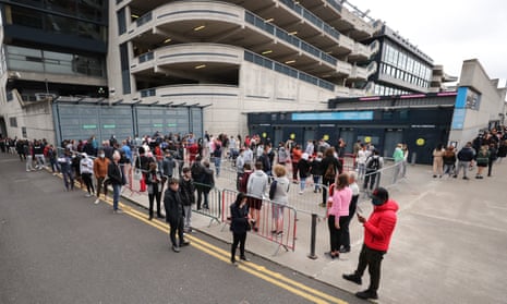 People queuing while waiting for the Covid-19 vaccine outside Croke Park, Dublin, which is being used as a temporary walk-in centre.