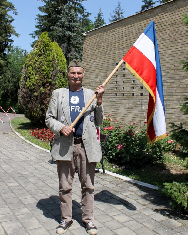 Man wielding Yugoslav flag