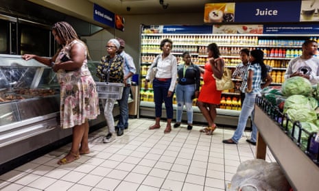 Shoppers queue at a Pick n Pay supermarket in Cape Town