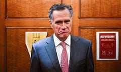 Mitt Romney reacts to a reporter's question at the Capitol in Washington.