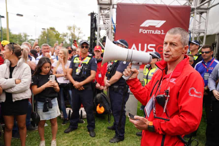 David Simpson, an official from the organisers, announces to the crowd waiting at the gate that the Australian Grand Prix has officially been cancelled.