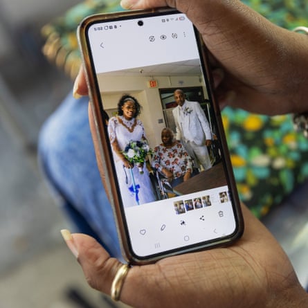 Yalonda Phillips looks at a photo from her wedding day with her mother, Mary Grant.