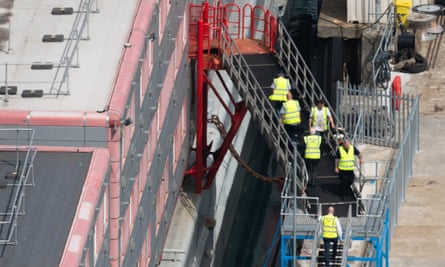 Workers at the Bibby Stockholm on Tuesday 1 August.