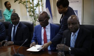 Haiti’s ministers for the interior, external co-operation and culture, Jean Marie Reynaldo Brunet, Aviol Fleurant and Joseph Guyler Delva, at a news conference announcing the banning of Oxfam GB.