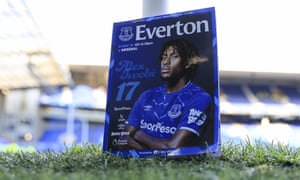 Everton’s former Arsenal midfielder Alex Iwobi features on the front of a matchday programme resting on the Goodison Park turf.
