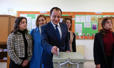 Nikos Christodoulides casts his ballot in Geroskipou village near Pafos, Cyprus, accompanied by his family.