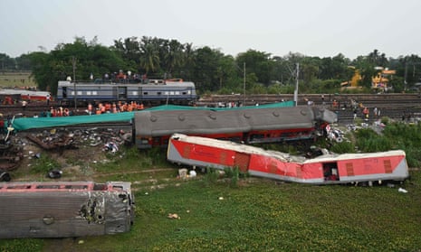 Emergency workers at the site of the three-train collision about  125 miles from Bhubaneswar in the eastern state of Odisha