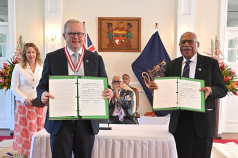 Australia’s Prime Minister Anthony Albanese and Fiji’s Prime Minister Sitiveni Rabuka sign a treaty and an alliance as Fiji’s President Ratu Naiqama Lalabalavu (C) looks on at State House in Suva, Fiji.