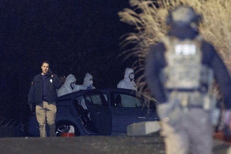 Investigators look at a grey Nissan car at a storage facility, where the Brown University shooter, identified by authorities as Claudio Neves Valente, took his own life, in Salem, New Hampshire, US, December 18, 2025.