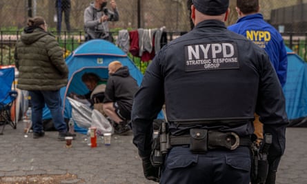 police officer looking at tent