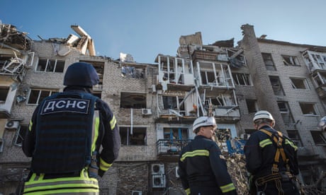 Ukrainian rescuers working at the site of a missile attack in the city of Pokrovsk.