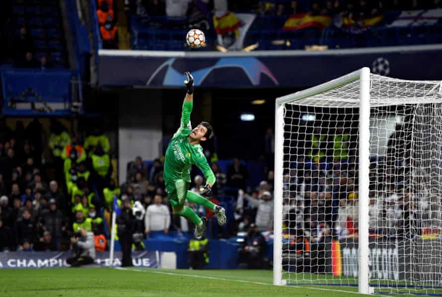 Real Madrid's Thibaut Courtois makes a flying save at Stamford Bridge